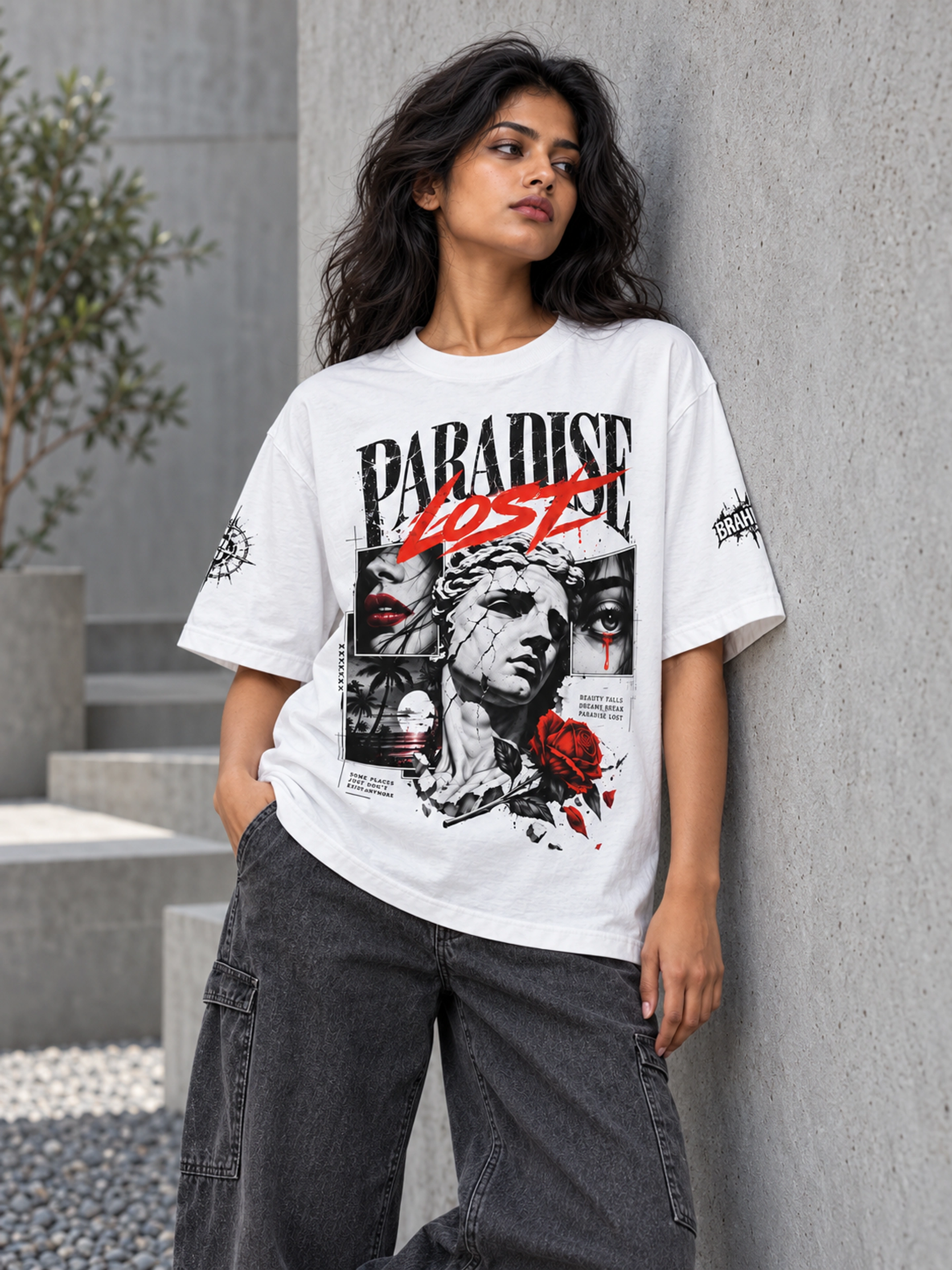 Model wearing a white Paradise Lost graphic tee beside a grey courtyard wall